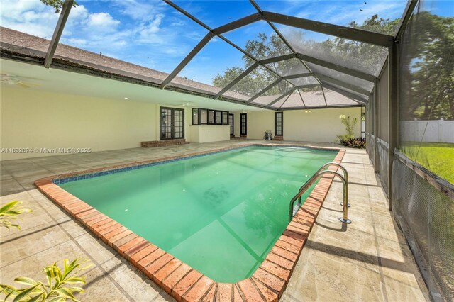 7804 SW 178th Ter, Palmetto Bay, FL 33157 - swimming pool featuring french doors, a patio, and glass enclosure