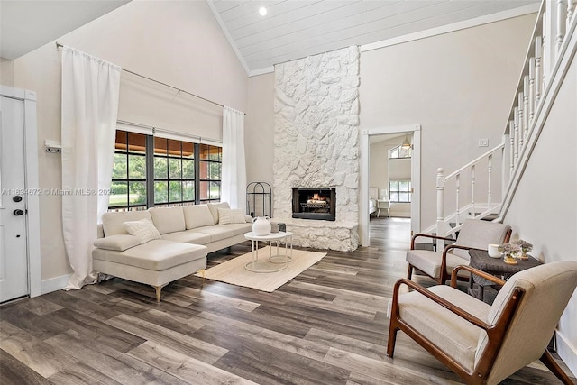 7264 159th Ct N, Palm Beach Gardens, FL 33418 - living room featuring high vaulted ceiling, stairs, wood finished floors, and a stone fireplace