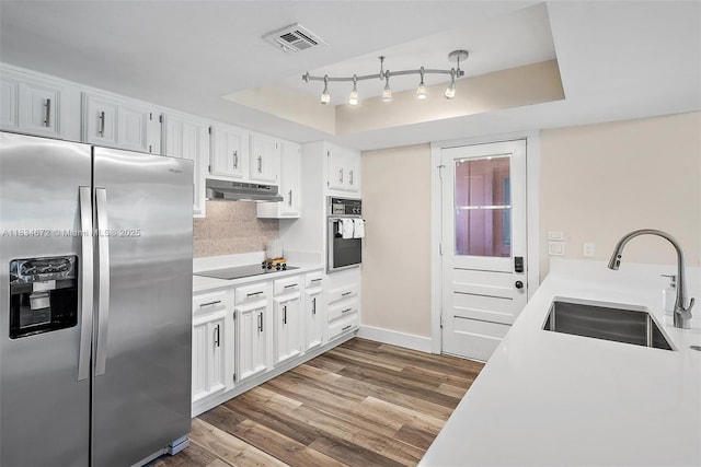 7264 159th Ct N, Palm Beach Gardens, FL 33418 - kitchen with appliances with stainless steel finishes, under cabinet range hood, dark wood-style floors, and backsplash