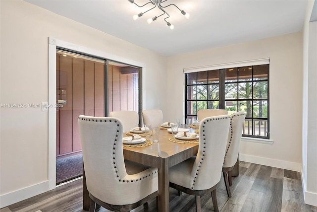 7264 159th Ct N, Palm Beach Gardens, FL 33418 - dining space featuring dark wood-style floors and a chandelier