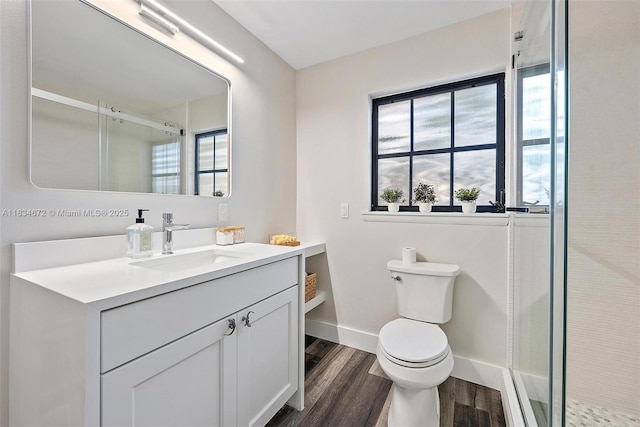 7264 159th Ct N, Palm Beach Gardens, FL 33418 - full bathroom featuring wood finished floors, a stall shower, and vanity