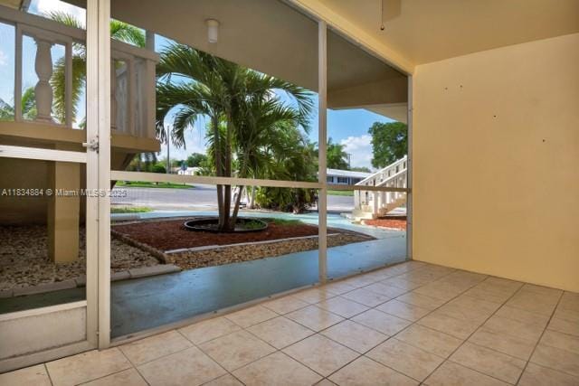 2101 NE 68th St Unit 103, Fort Lauderdale, FL 33308 - entryway with tile patterned flooring and ceiling fan