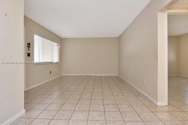 2101 NE 68th St Unit 103, Fort Lauderdale, FL 33308 - unfurnished room featuring light tile patterned flooring and baseboards