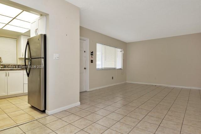 2101 NE 68th St Unit 103, Fort Lauderdale, FL 33308 - unfurnished room with light tile patterned flooring