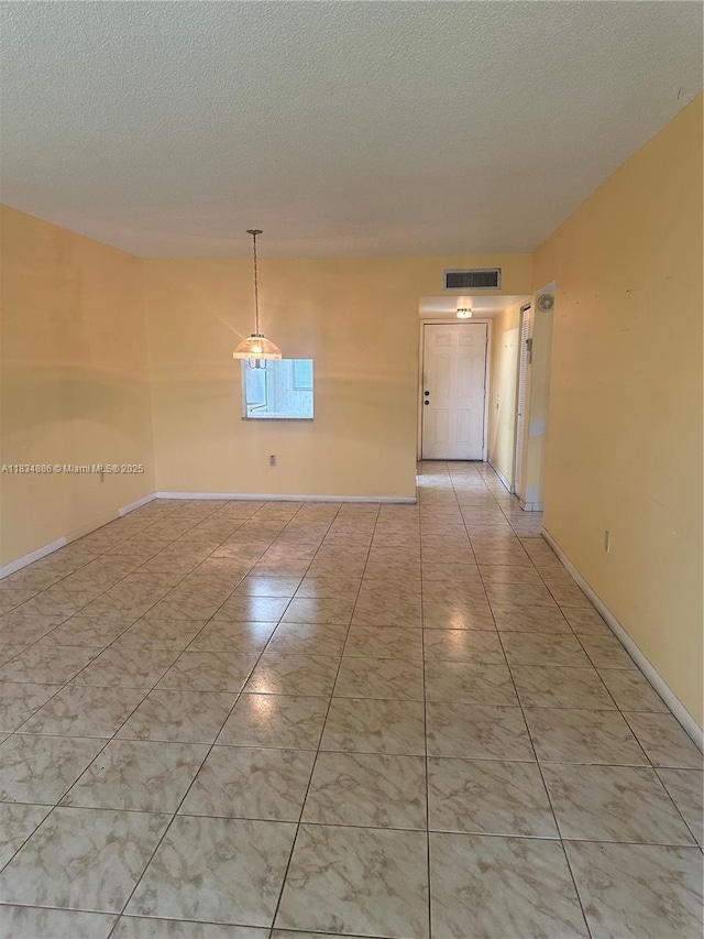 5945 Del Lago Cir Unit 201, Sunrise, FL 33313 - unfurnished room featuring a textured ceiling and baseboards
