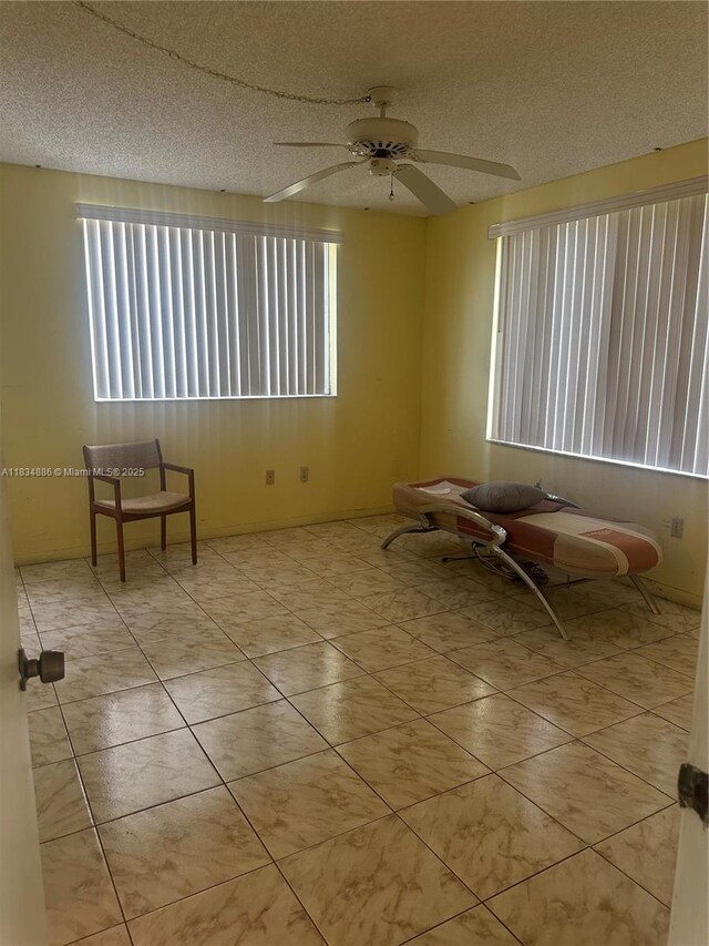 5945 Del Lago Cir Unit 201, Sunrise, FL 33313 - empty room with ceiling fan and a textured ceiling