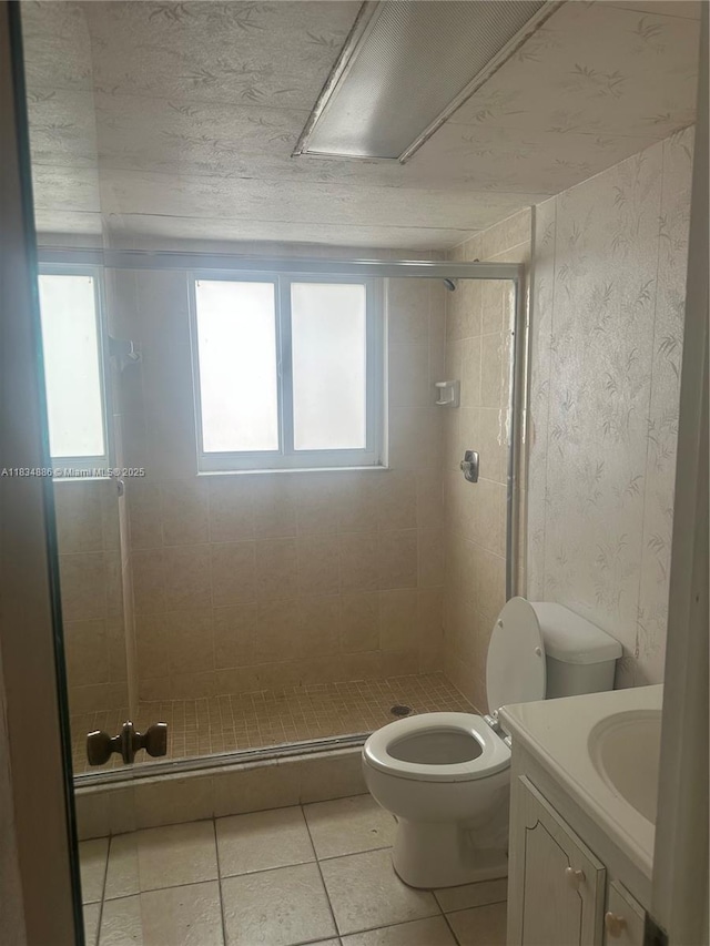 5945 Del Lago Cir Unit 201, Sunrise, FL 33313 - bathroom featuring vanity, a stall shower, and tile patterned floors