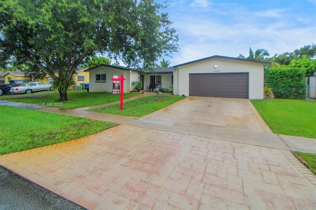 12000 NW 20th St, Pembroke Pines, FL 33026 - single story home with driveway, a front lawn, stucco siding, and an attached garage