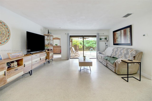 12000 NW 20th St, Pembroke Pines, FL 33026 - living area featuring speckle patterned floor and baseboards