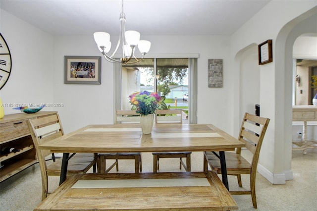 12000 NW 20th St, Pembroke Pines, FL 33026 - dining area with arched walkways, a chandelier, and light colored carpet