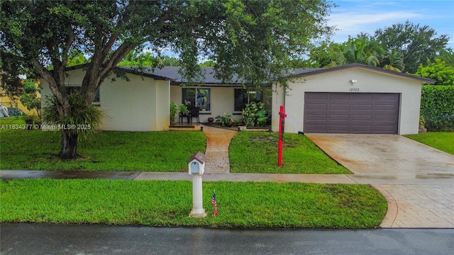 12000 NW 20th St, Pembroke Pines, FL 33026 - ranch-style house featuring stucco siding, a garage, concrete driveway, and a front lawn
