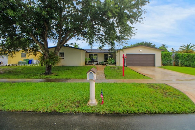 12000 NW 20th St, Pembroke Pines, FL 33026 - ranch-style house with stucco siding, driveway, a front yard, and an attached garage