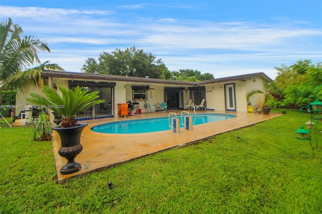 12000 NW 20th St, Pembroke Pines, FL 33026 - swimming pool featuring a yard, a patio, and ceiling fan