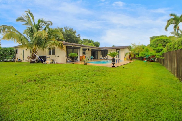 12000 NW 20th St, Pembroke Pines, FL 33026 - back of house with a fenced backyard, a patio area, and stucco siding