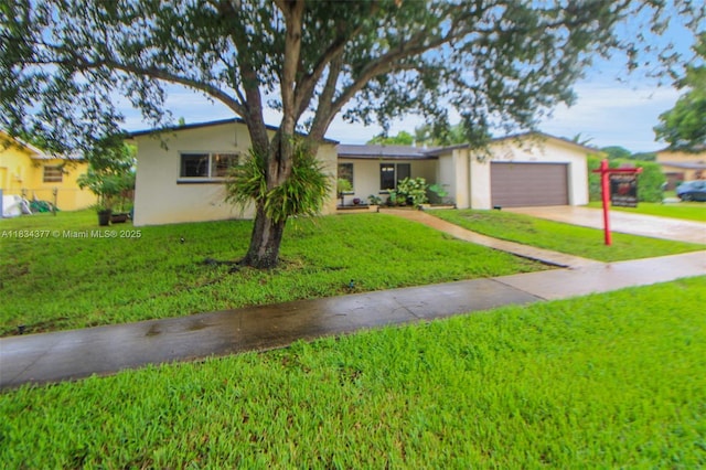 12000 NW 20th St, Pembroke Pines, FL 33026 - ranch-style house with stucco siding, concrete driveway, a garage, and a front yard