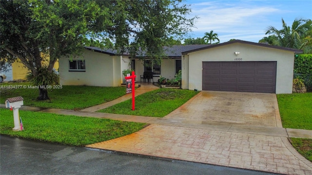 12000 NW 20th St, Pembroke Pines, FL 33026 - ranch-style home with stucco siding, concrete driveway, a front yard, and a garage