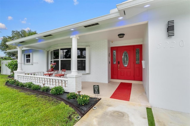 5220 SW 6th St, Plantation, FL 33317 - view of exterior entry featuring covered porch and brick siding