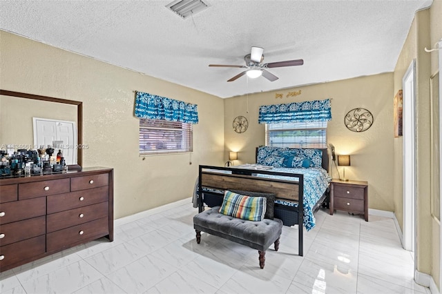 5220 SW 6th St, Plantation, FL 33317 - bedroom featuring multiple windows, a textured ceiling, and a ceiling fan