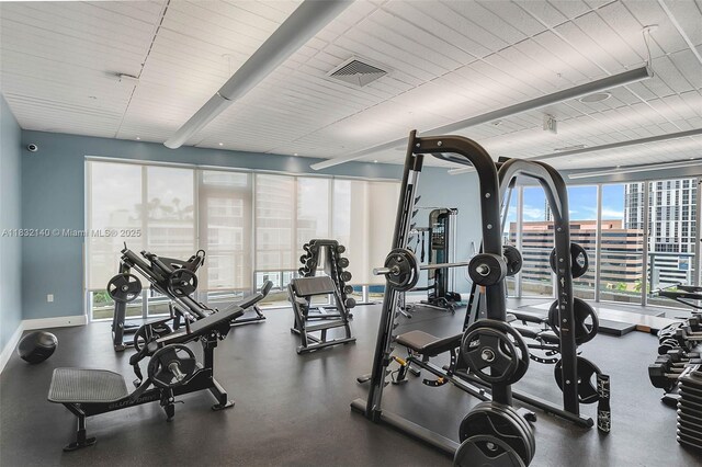 185 SW 7th St Unit 2204, Miami, FL 33130 - gym with baseboards and beam ceiling