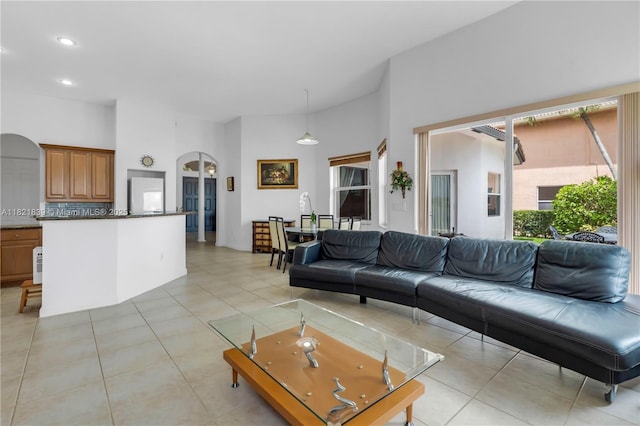 18633 SW 24th St, Miramar, FL 33029 - living room featuring arched walkways, recessed lighting, light tile patterned floors, and a towering ceiling