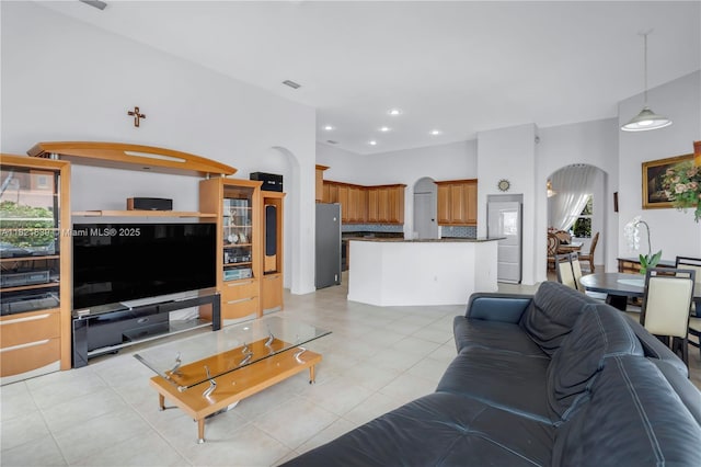 18633 SW 24th St, Miramar, FL 33029 - living room featuring arched walkways, light tile patterned floors, and recessed lighting