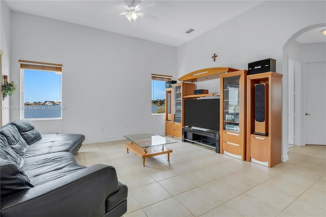 18633 SW 24th St, Miramar, FL 33029 - living room featuring arched walkways, a ceiling fan, and light tile patterned floors