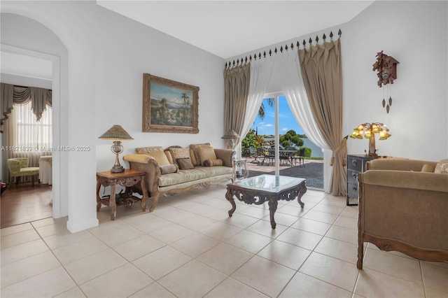 18633 SW 24th St, Miramar, FL 33029 - living room with light tile patterned floors, healthy amount of natural light, and arched walkways