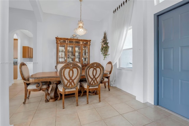 18633 SW 24th St, Miramar, FL 33029 - dining room featuring arched walkways, light tile patterned flooring, and a chandelier