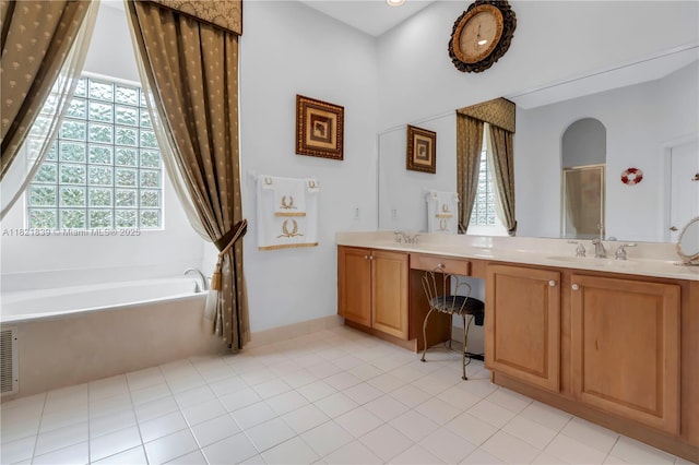 18633 SW 24th St, Miramar, FL 33029 - bathroom with plenty of natural light, a bath, double vanity, and tile patterned floors