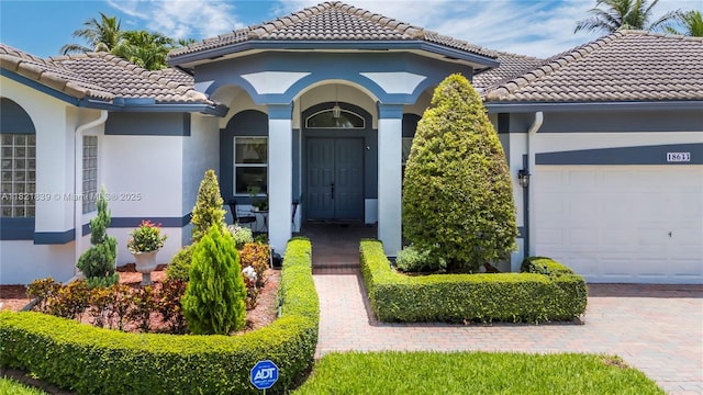 18633 SW 24th St, Miramar, FL 33029 - entrance to property with a tiled roof, stucco siding, and a garage