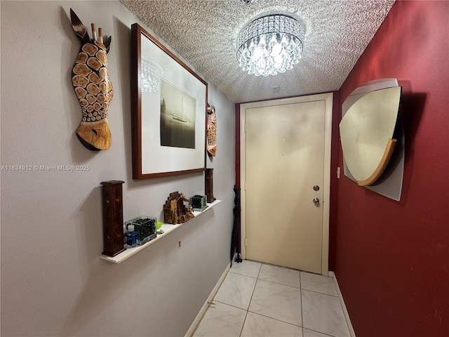 3910 Inverrary Blvd Unit 603-B, Lauderhill, FL 33319 - doorway with light marble finish flooring, a textured ceiling, and a chandelier