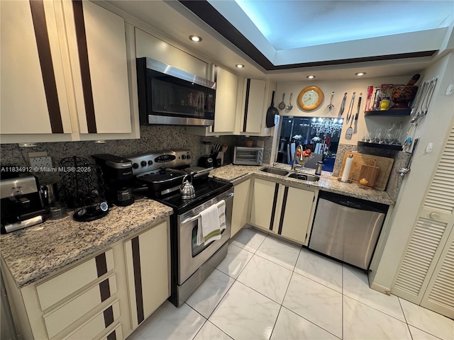3910 Inverrary Blvd Unit 603-B, Lauderhill, FL 33319 - kitchen featuring appliances with stainless steel finishes, tasteful backsplash, recessed lighting, light marble finish floors, and light stone counters