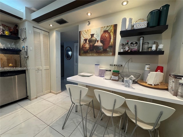 3910 Inverrary Blvd Unit 603-B, Lauderhill, FL 33319 - kitchen with stainless steel dishwasher, light countertops, recessed lighting, and open shelves