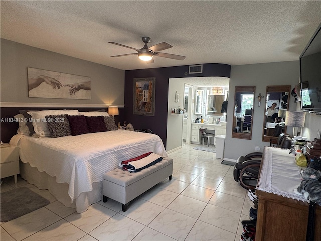 3910 Inverrary Blvd Unit 603-B, Lauderhill, FL 33319 - bedroom with a textured ceiling, connected bathroom, ceiling fan, and light tile patterned flooring