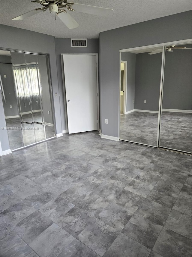 800 SW 142nd Ave Unit N111, Pembroke Pines, FL 33027 - unfurnished bedroom featuring a textured ceiling and ceiling fan