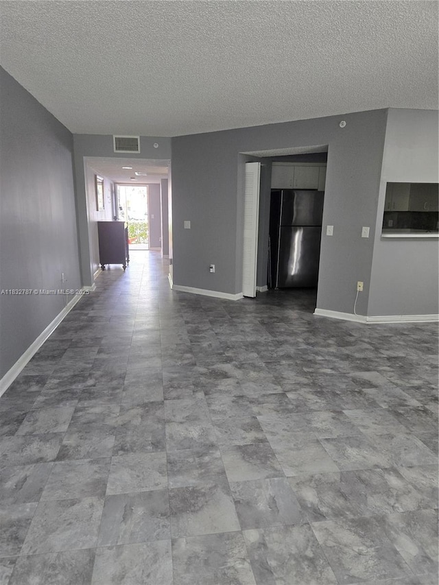 800 SW 142nd Ave Unit N111, Pembroke Pines, FL 33027 - empty room with a textured ceiling and baseboards