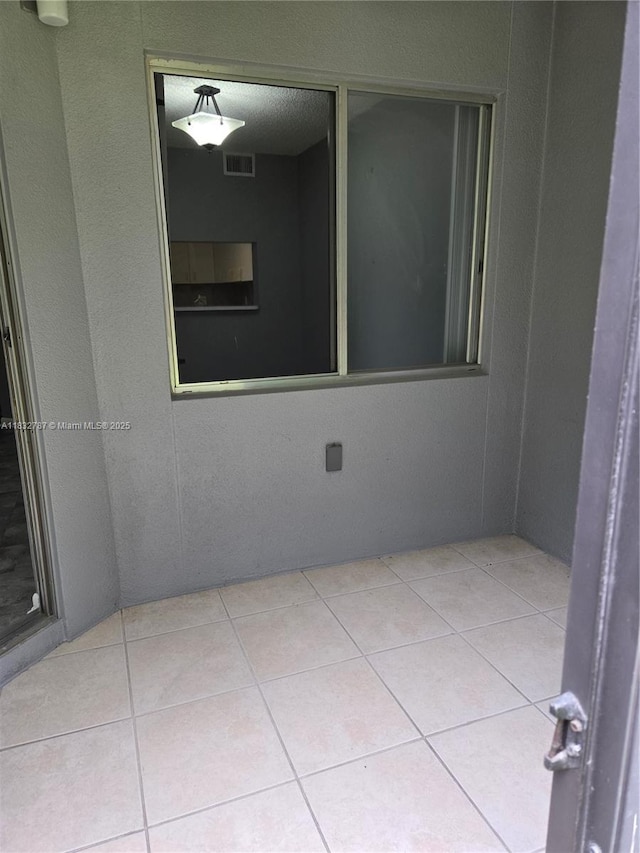 800 SW 142nd Ave Unit N111, Pembroke Pines, FL 33027 - spare room with tile patterned floors