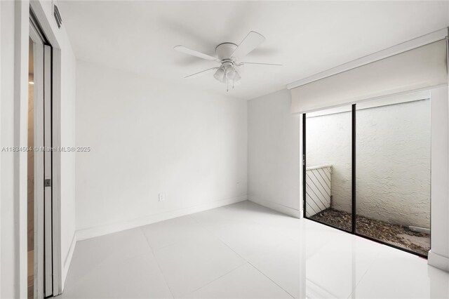 20218 NE 34th Ct Unit 52, Aventura, FL 33180 - unfurnished bedroom featuring a ceiling fan