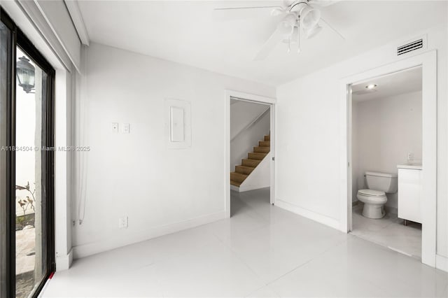 20218 NE 34th Ct Unit 52, Aventura, FL 33180 - unfurnished bedroom featuring ensuite bath, tile patterned flooring, and ceiling fan