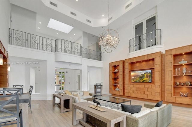 3205 NE 184th St Unit 9106, Aventura, FL 33160 - living room with light wood-type flooring, a towering ceiling, a skylight, a chandelier, and recessed lighting
