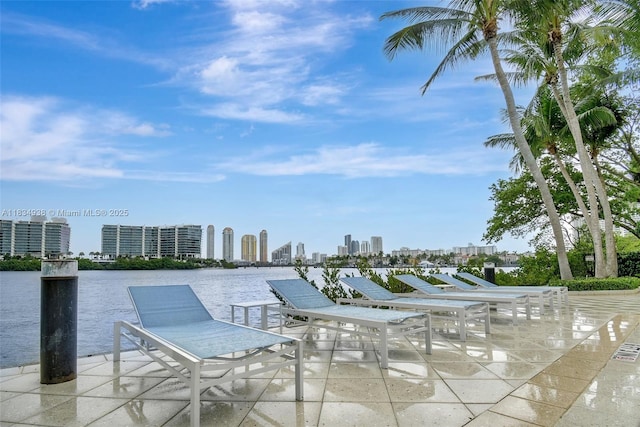 3205 NE 184th St Unit 9106, Aventura, FL 33160 - view of patio / terrace featuring a view of skyline and a water view