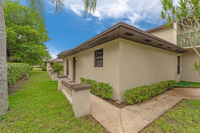 13926 SW 46th Ter Unit A 351, Miami, FL 33175 - view of side of home featuring stucco siding and a lawn