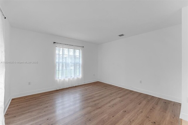 13926 SW 46th Ter Unit A 351, Miami, FL 33175 - empty room with light wood-style flooring and baseboards
