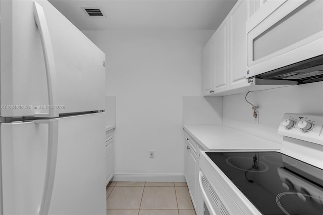 13926 SW 46th Ter Unit A 351, Miami, FL 33175 - kitchen with white appliances, white cabinetry, light countertops, and light tile patterned floors