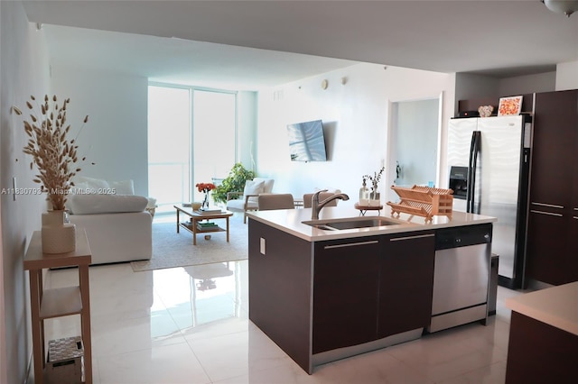 1900 N Bayshore Dr Unit 3804, Miami, FL 33132 - kitchen with appliances with stainless steel finishes, a center island with sink, light countertops, healthy amount of natural light, and floor to ceiling windows