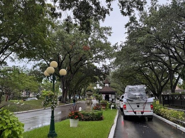 3690 Inverrary Dr Unit 1T, Lauderhill, FL 33319 - view of asphalt road featuring curbs