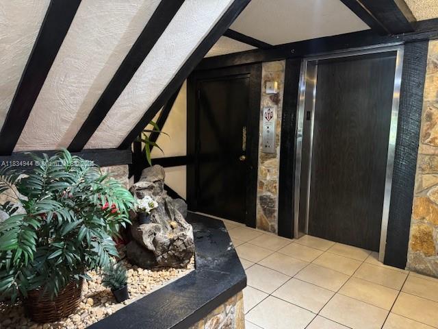 3690 Inverrary Dr Unit 1T, Lauderhill, FL 33319 - foyer featuring tile patterned floors