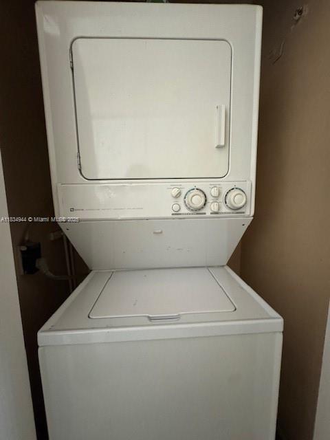 3690 Inverrary Dr Unit 1T, Lauderhill, FL 33319 - laundry area with estacked washer and dryer