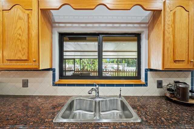 14040 SW 14th St, Davie, FL 33325 - kitchen with decorative backsplash, plenty of natural light, and brown cabinets