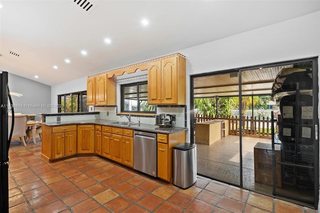 14040 SW 14th St, Davie, FL 33325 - kitchen with stainless steel dishwasher, a peninsula, recessed lighting, backsplash, and dark stone counters